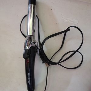 PERFECTION CURLING IRON.